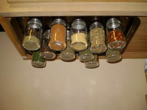 A magnetic spice rack. A cookie sheet screwed to the under side of the cupbaord.