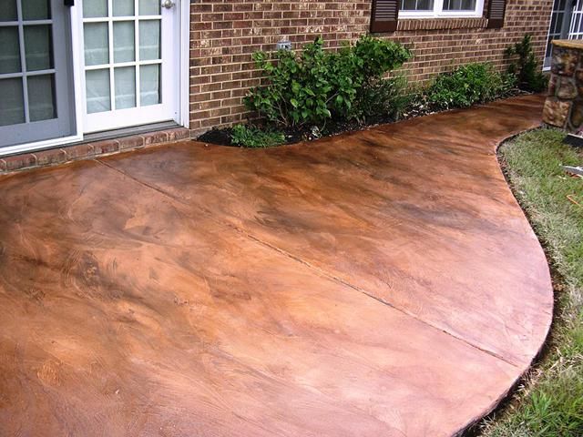Acid-stained Concrete. love this- it looks like a copper walkway.