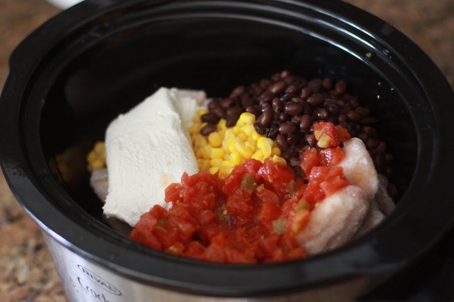 Bag of frozen chicken in the crock pot. Put the cream cheese, corn, salsa and bl