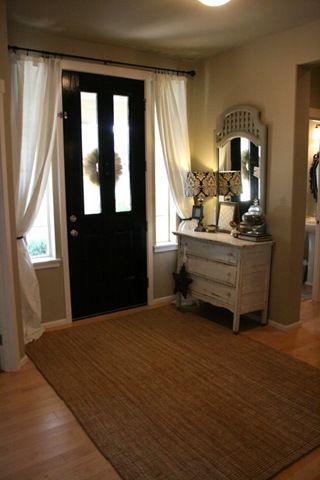Curtain rod over the front door! Awesome idea!!