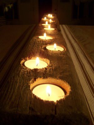 Drill holes in wood, place tea lights. Table center piece for outside table.
