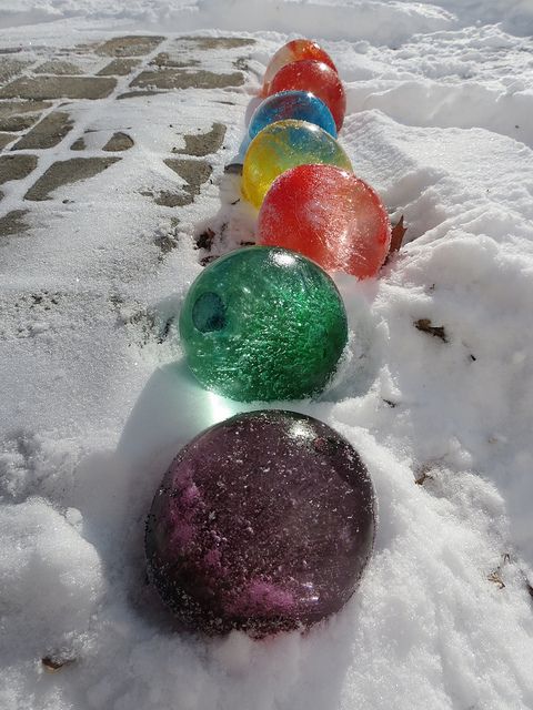 Fill balloons with water and add food coloring, once frozen cut the balloons off