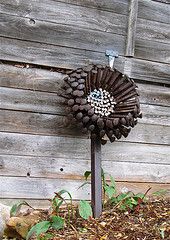 Flowers from bolts & nails / these would rust nicely!