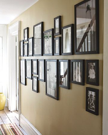 Mark a horizontal line on the wall, and hang all pictures above or below it. Who