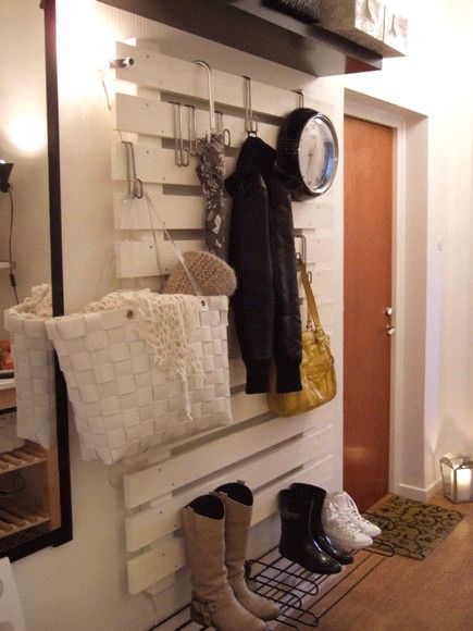 Paint a pallet white and hang stuff from it with overdoor hooks. #organize