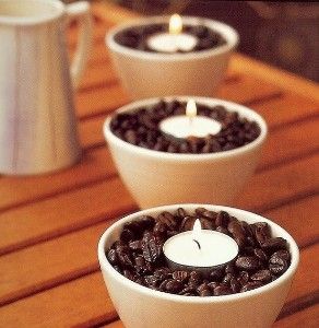 Place vanilla scented tea lights in a bowl of coffee beans. The warmth of the ca