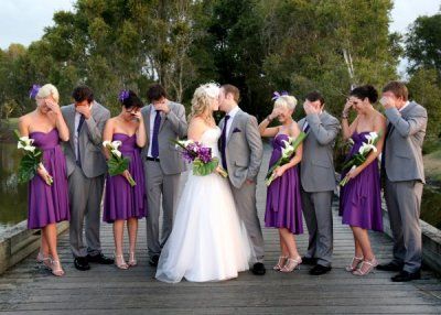 Purple bridesmaid and grey tuxes