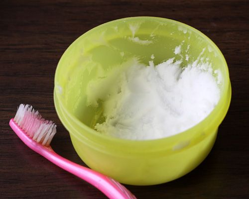 Put a tiny bit of toothpaste into a small cup, mix in one teaspoon baking soda a