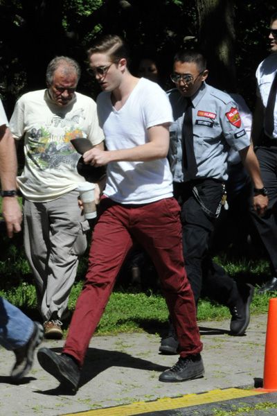Robert Pattinson tames his mane on Cosmopolis set