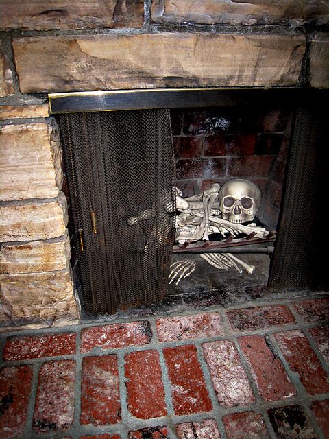 Skeleton in the fireplace.  Clever