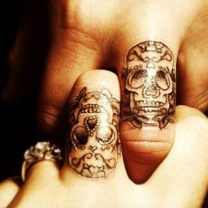 Sugar skull finger Tattoo by doris