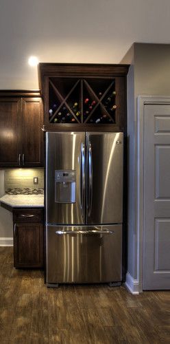 Take cabinet doors off above fridge and convert to wine storage.