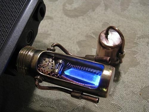 This awesomely steampunk USB drive has a crystal inside that lights up blue when