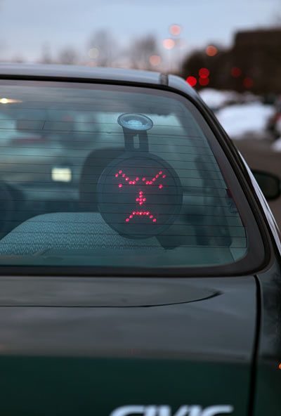 This goes on your back windshield & you have a control upfront that lets you