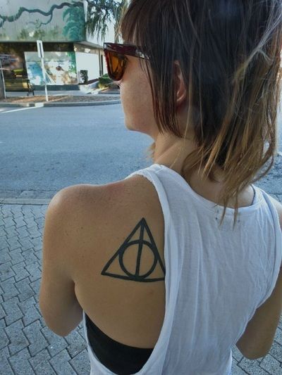 This is the deathly hallows symbol from Harry Potter. Not only did I get it beca
