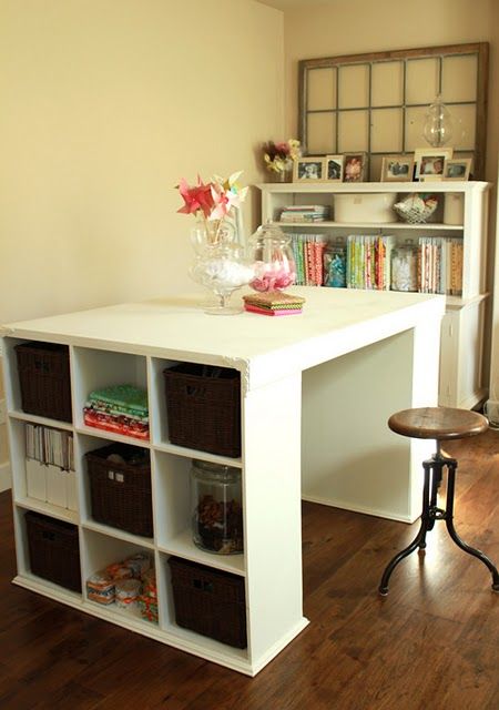Two bookshelves, a board and some molding around the bottom- desk, island, craft