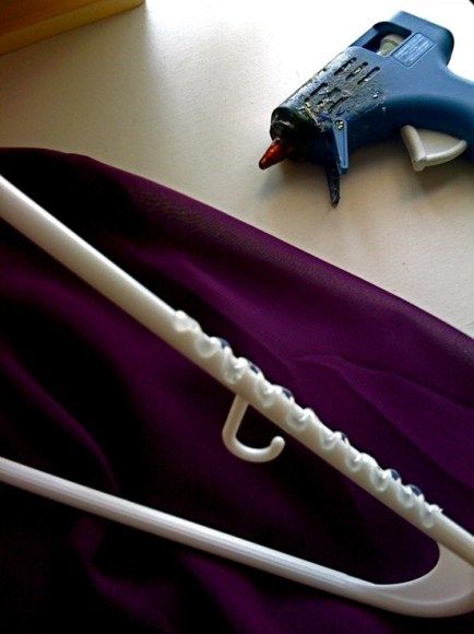 Use a hot glue gun on a plastic hanger to prevent clothes from slipping off