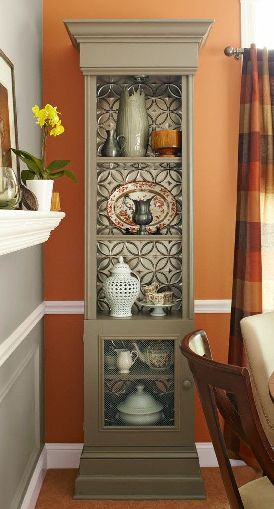 Use tin ceiling/backsplash tiles in the back of a bookcase.