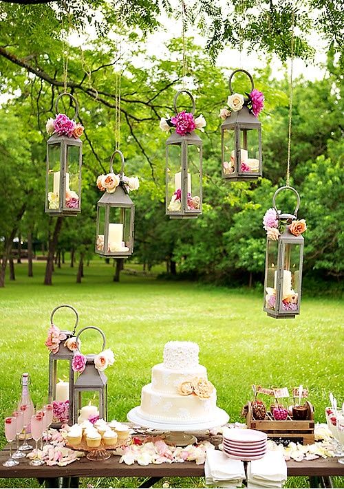 cake table with hanging lanterns