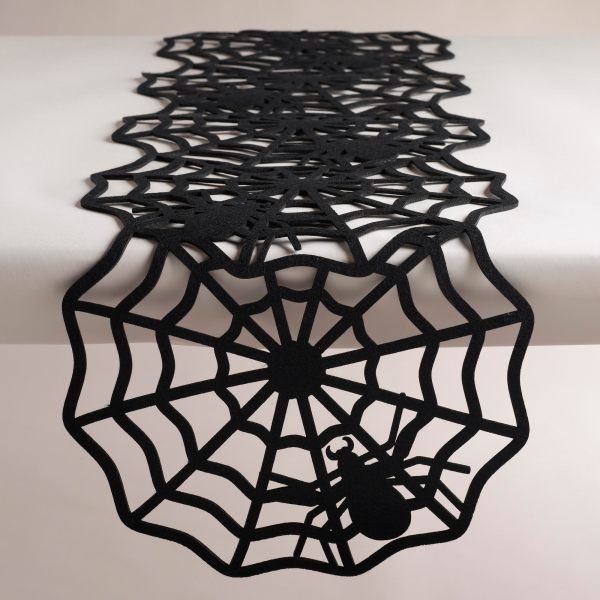 A spider web table runner -   40 Spooky Halloween Decorating Ideas for Your Stylish Home