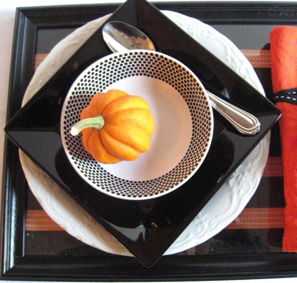 A Halloween table setting -   40 Spooky Halloween Decorating Ideas for Your Stylish Home