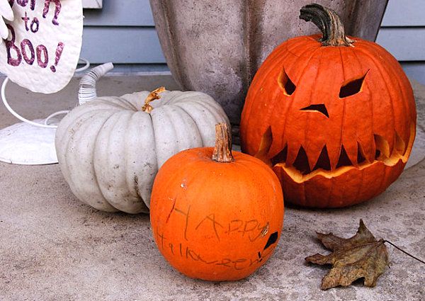 A grouping of Halloween pumpkins -   40 Spooky Halloween Decorating Ideas for Your Stylish Home