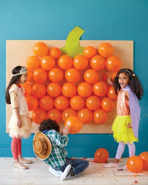 put candy inside the balloons and have the kids throw darts to get it out – and