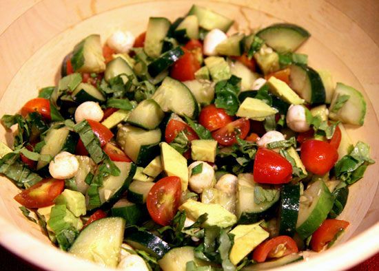 2 cucumbers- cut up, 1 pint cherry or grape tomatoes, 2 tablespoons chopped fres