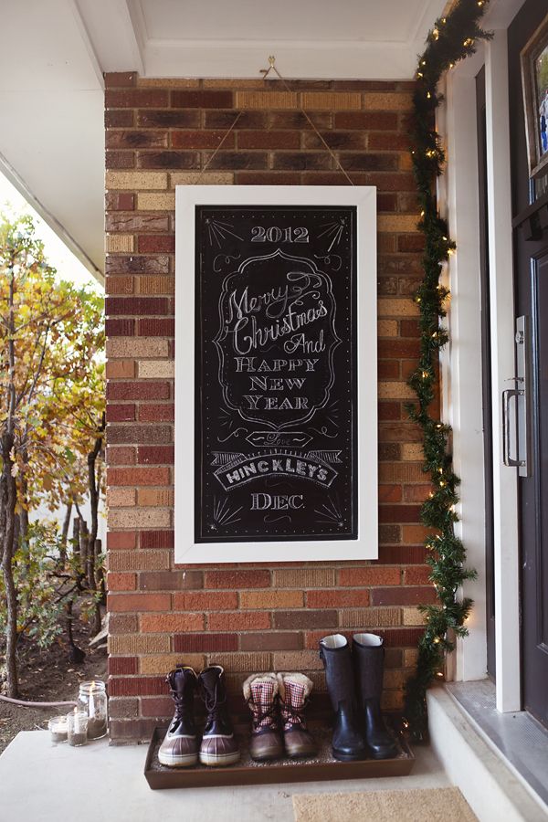 A chalkboard welcome sign for the front door