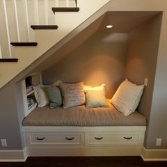 A small nook with a light, shelves, and drawer storage.