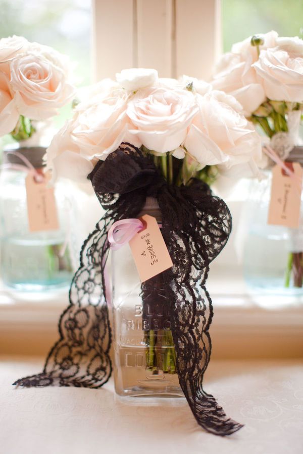 Blush roses and thick black lace. Love the color palette