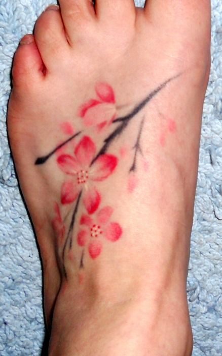 Cherry blossom foot tattoo.