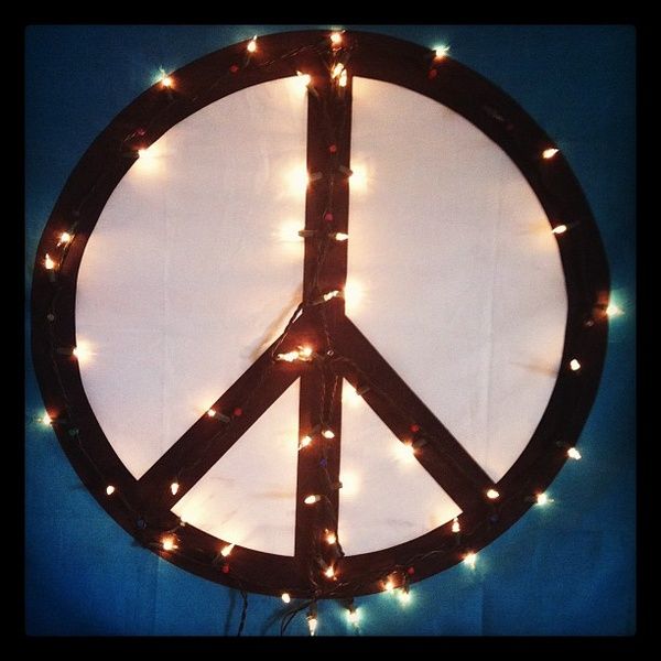Christmas lights from a thrift store, push pins and a peace sign flag. Perfect a