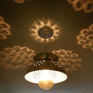 Colander Lamp, the reflections are awesome. would be fun in the kitchen