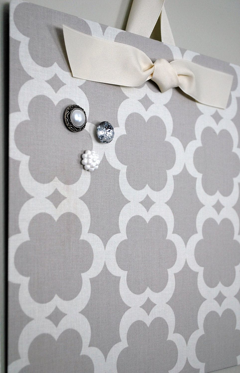 Flat cookie sheet covered in fabric becomes a cute magnet board