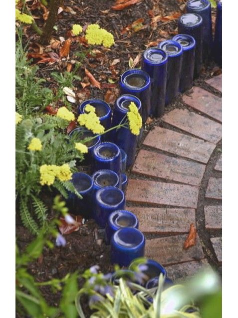 Garden Path Edging  Rinse out and empty wine, soda or beer bottles.  Turn them u
