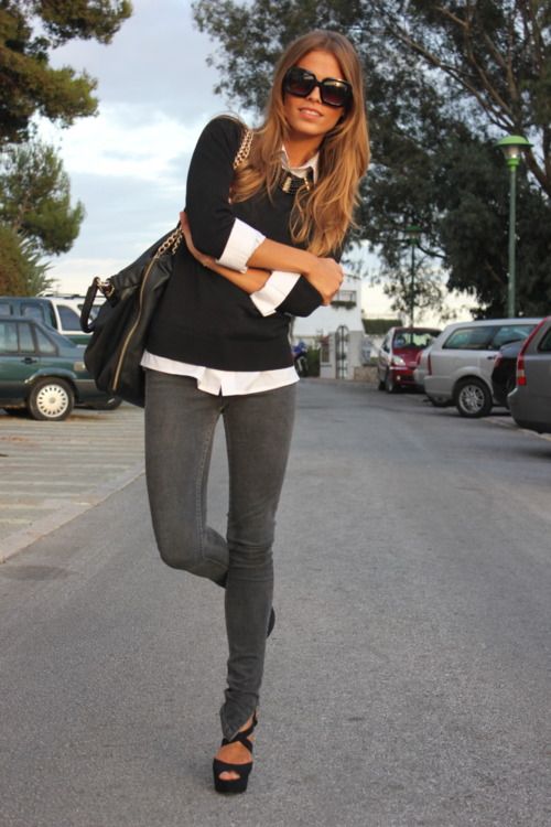 Grey skinny jeans, white button up and black sweater.