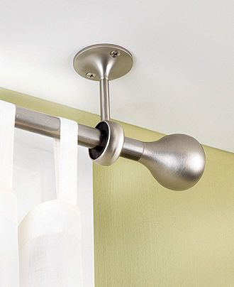 Hang curtains from the ceiling. Avoid measuring and makes ceilings look taller!