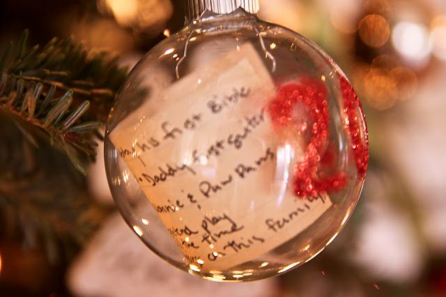 Kids' Christmas list in an ornament with the year.
