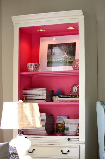 Paint inside bookcase shelves a different color.