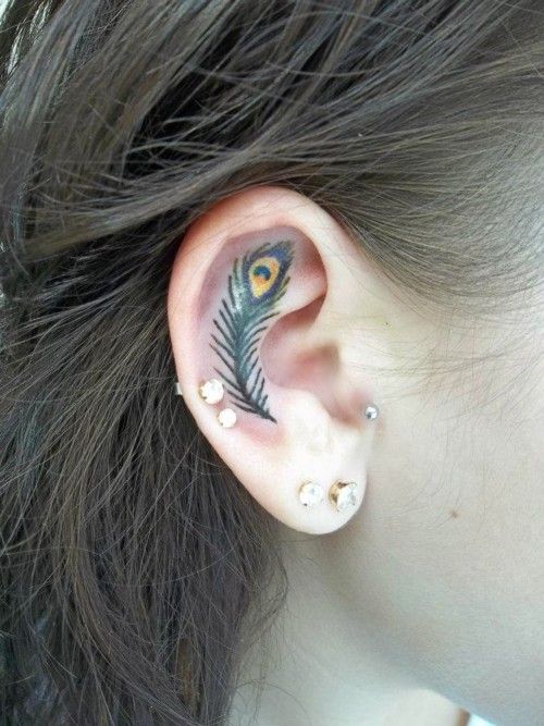 Peacock ear tattoo