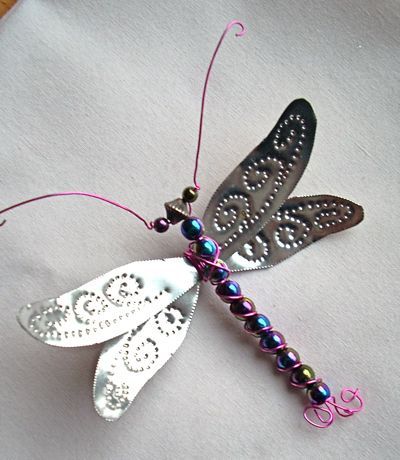 Punched tin, beads, and wiring make this beautiful dragonfly ornament.