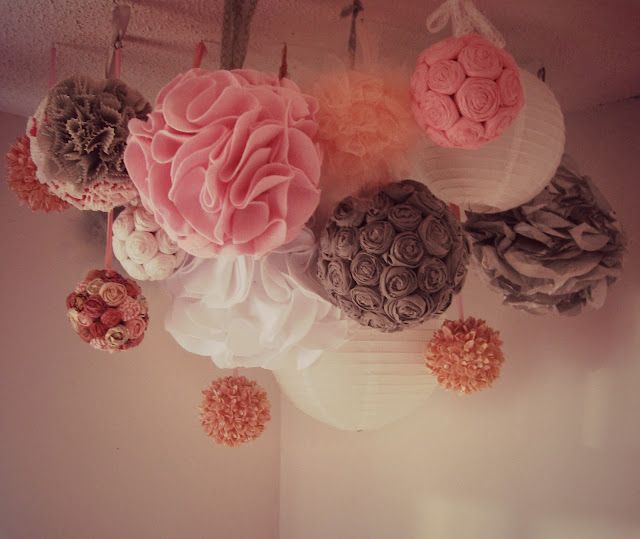 Tutorial for this fun multipurpose pink and grey DIY POM POM chandelier/mobile!