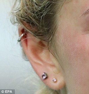 Laura revealed her right ear has double piercings in the lobe and a ... -   Ear head piercing