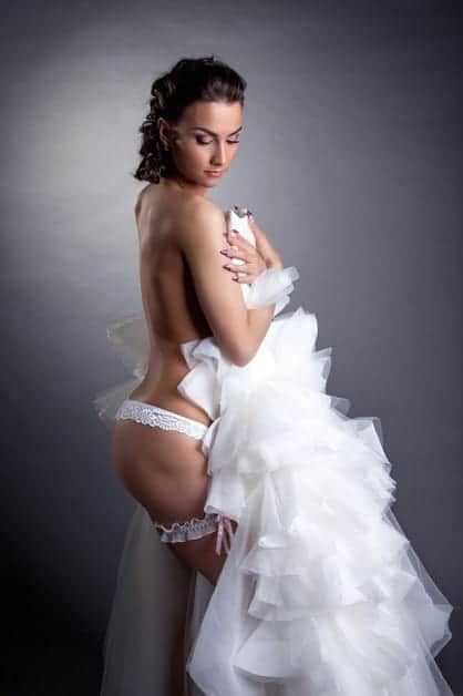 Boudoir photo shoot of bride with wedding dress -   Boudoir wedding photo shoot Ideas