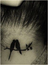 two #bird resting on a branch #tattoo behind neck