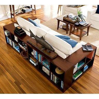 wrap the couch in bookshelves rather than have end tables!