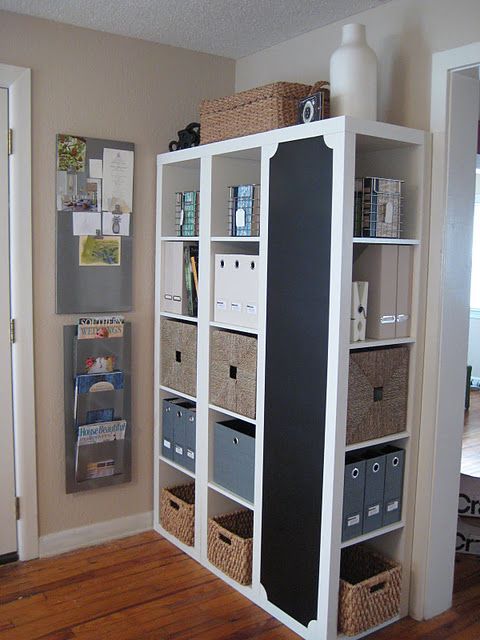 3 bookcases from Ikea – one turned sideways & painted w/ chalkboard paint.