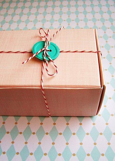 A button and baker's twine pair up for another other gift wrap idea.