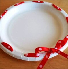 A cookie plate you don't need back. All you need is a hole punch and ribbon.